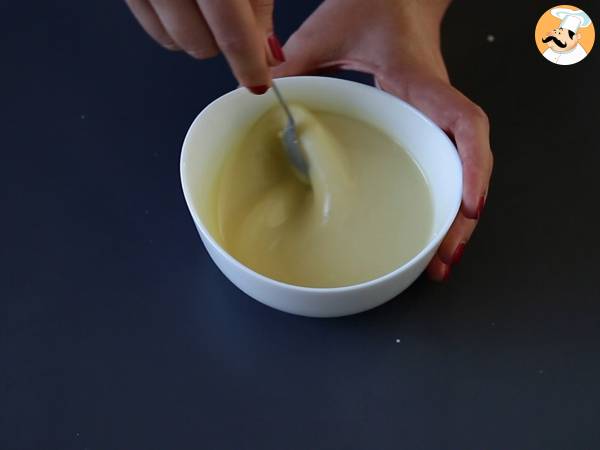 Kokosnussgläser nach Raffaello-Art ohne Backen - ein märchenhaftes Dessert in einer Schneekugel - Zubereitung Schritt 4